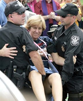Cindy Sheehan being arrested and happy about it
