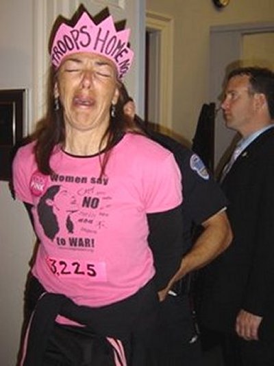 Girl from CodePINK crying while being arrested