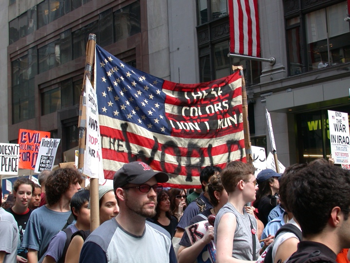 A Liberal Protester Disrespecting the Flag